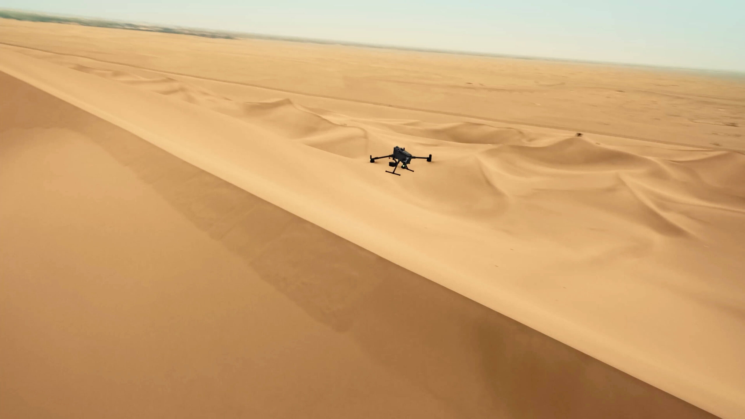 DJI Matrice 400 in flight with an example mission payload; payloads sold separately unless specified.
